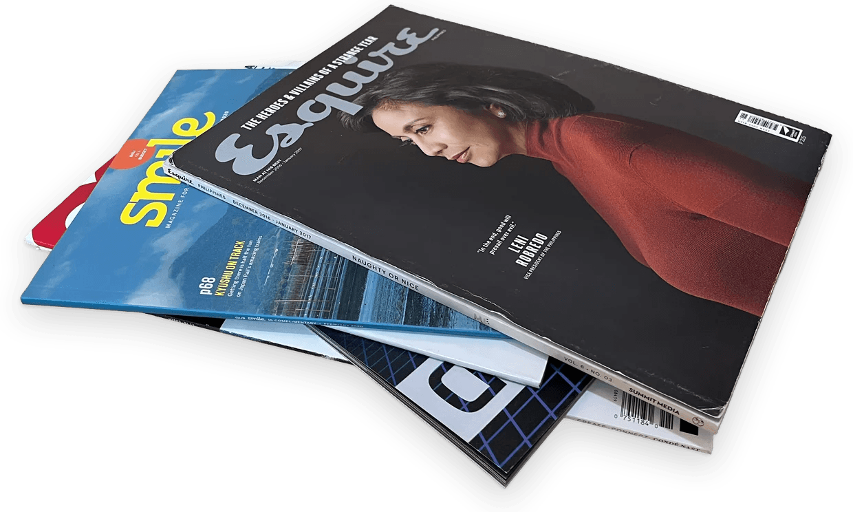 A pile of magazines, Esquire Philippines on top and Smile beneath it.