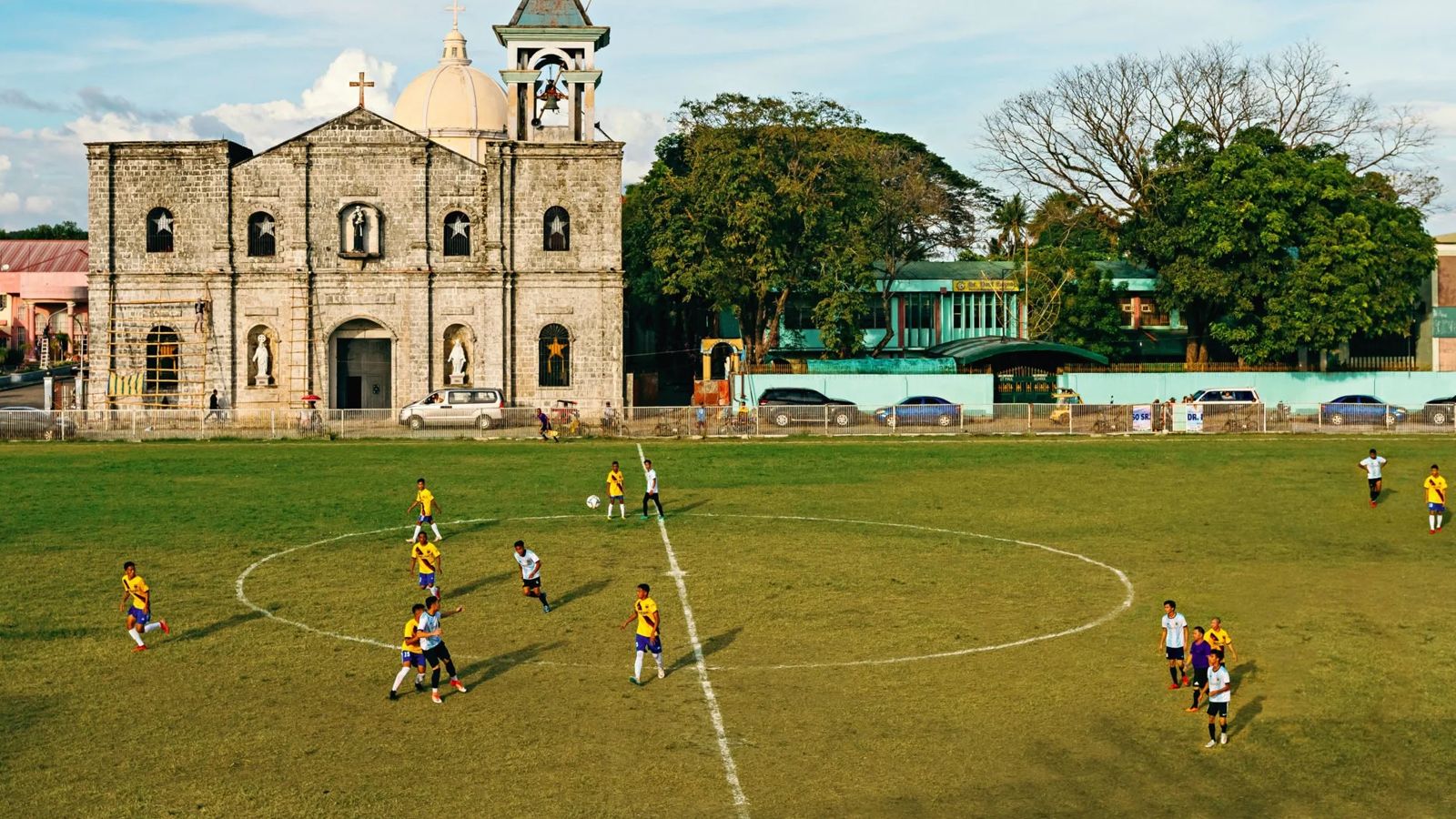 Footballers on a pitch in Barotac Nuevo, Iloilo, for a Smile Magazine cover story.